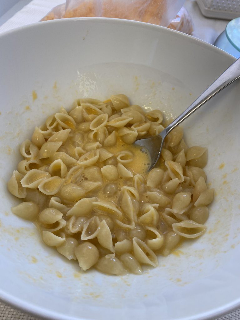 Microwave Mac and Cheese halfway cooked showing how the consistency of the sauce should look at this stage of the recipe